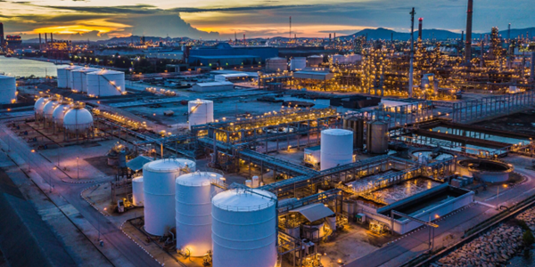 Sunset refinery with tanks and industrial lights.Storage Technologies